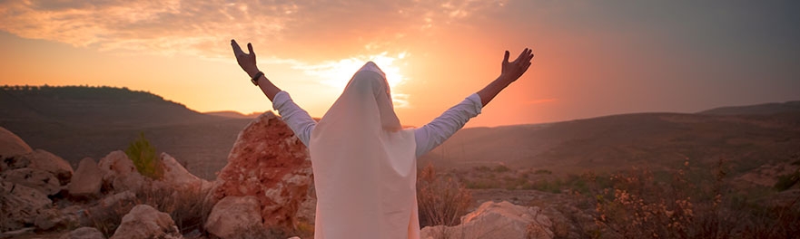 Jesus raises his arms to welcome the sunrise