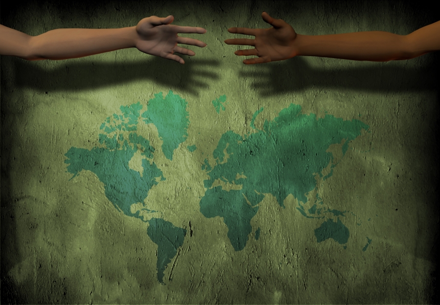 Illustration of hands reaching symbolically across a map of the world