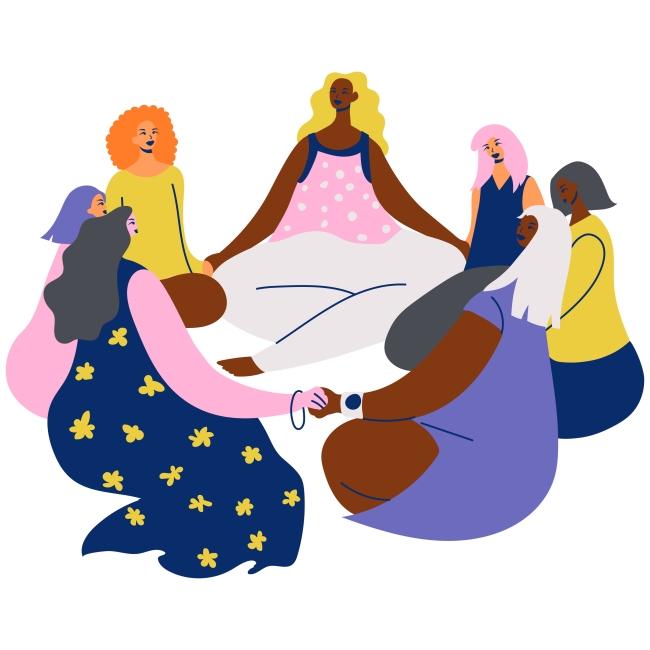 Women sitting in a circle holding hands