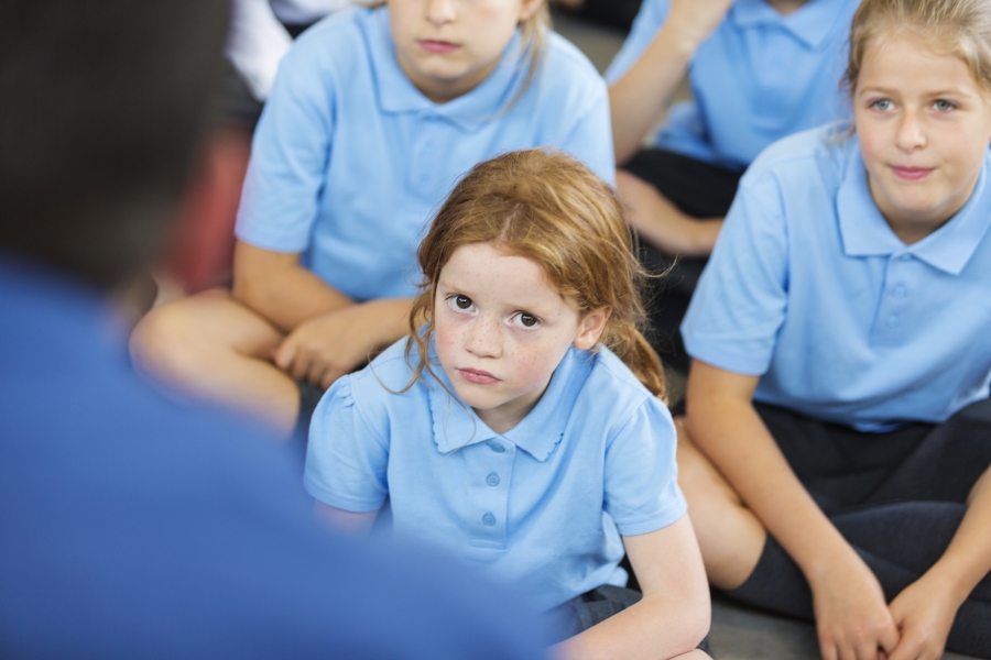 Children listening to a teacher